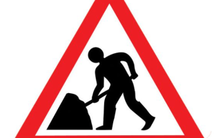 Image of road sign showing man digging